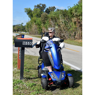 A Person Riding a Blue EV Rider Vita Monster Scooter